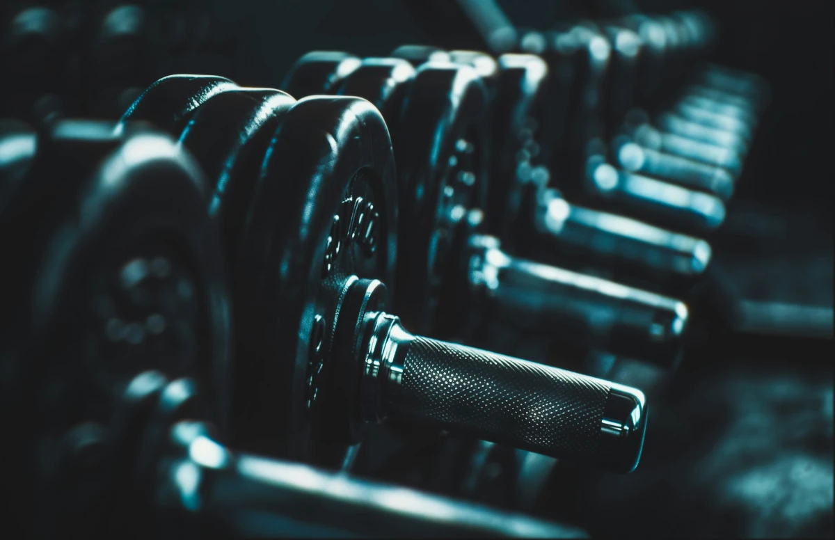 A set of gym weights on a rack